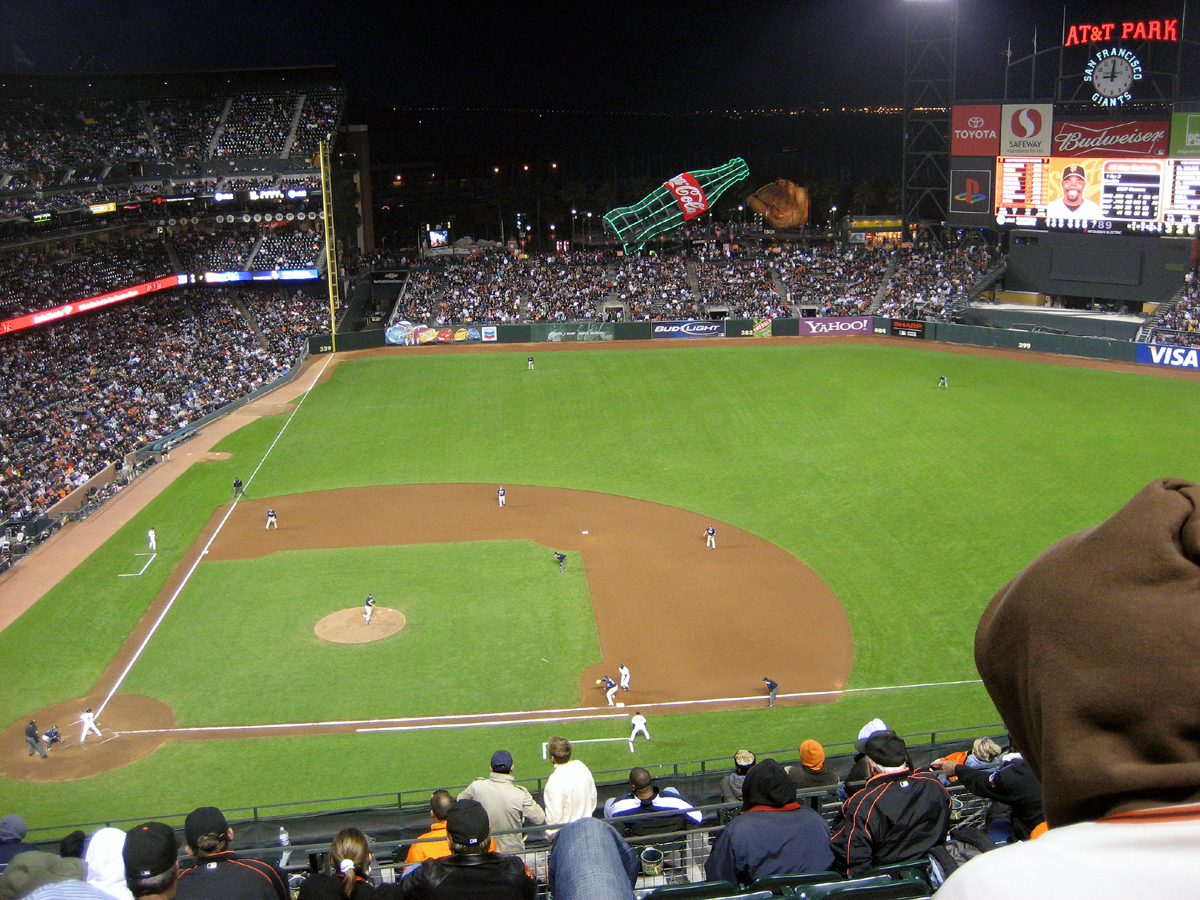 a baseball game is in full swing with many people watching