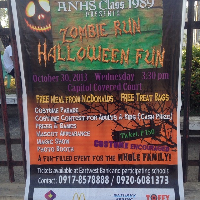 an advertit for a halloween event on the sidewalk