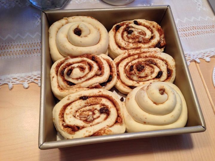 several cinnamon rolls in a pan on a table