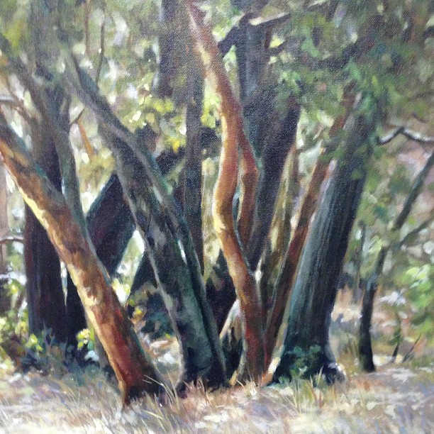 a painting of trees in the grass by some bushes