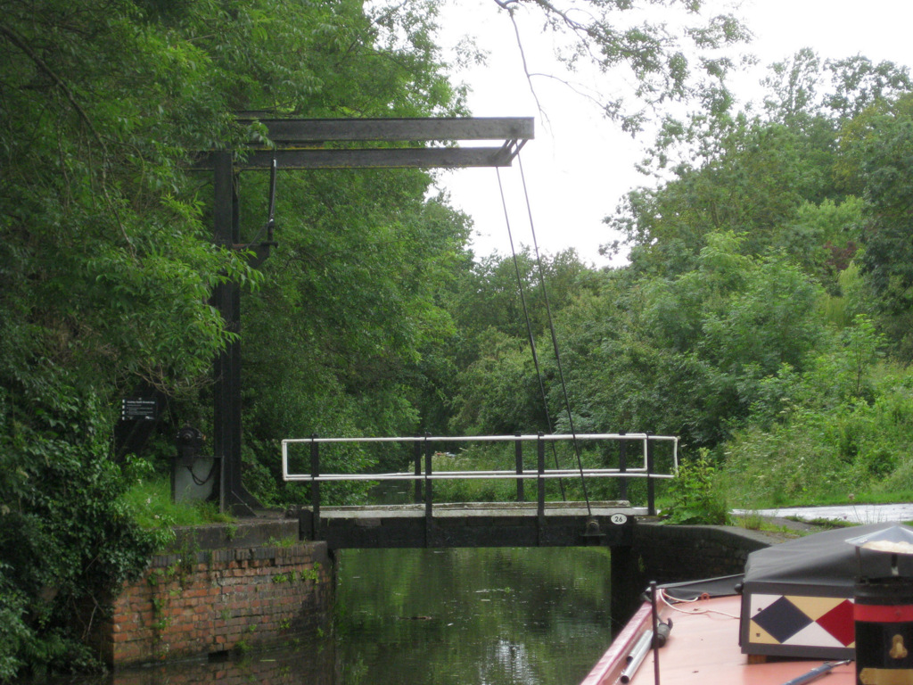 an overhead train bridge crossing over a river