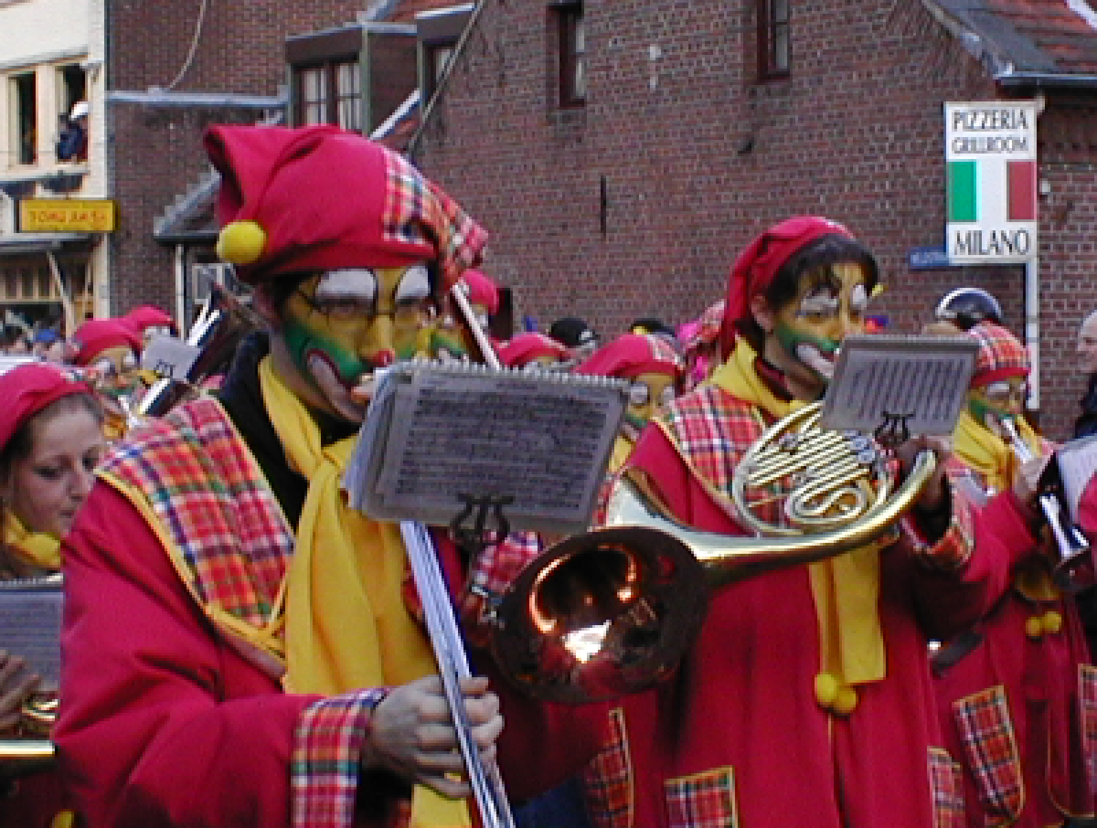 a group of people in fancy clothing with instruments