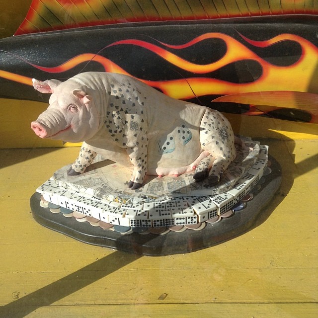 a sculpture of a pig is shown on display