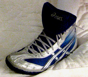 the shoe has a white top and blue trim