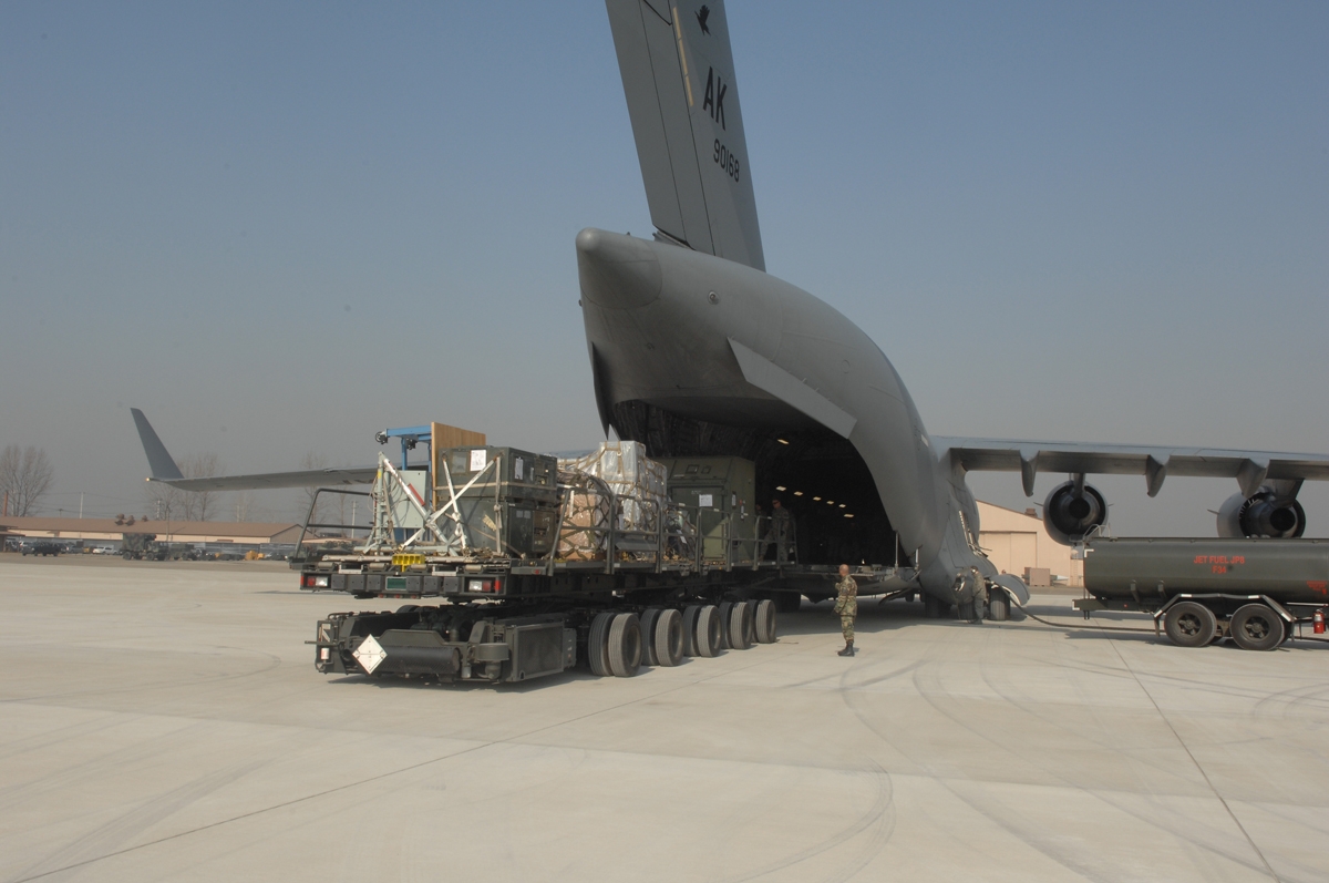 a large gray airplane on a run way