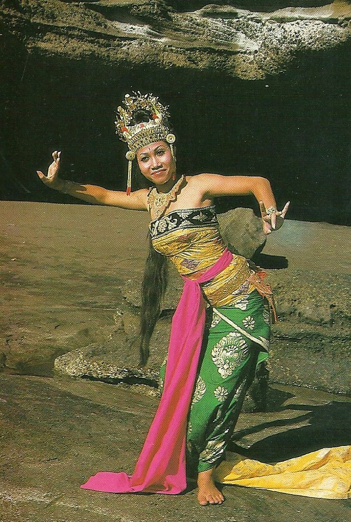 a woman is wearing an elaborate headdress and a headdress