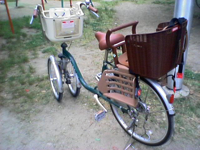 the old fashioned bicycle has a basket on it