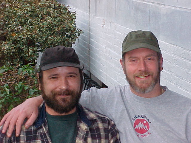 two men wearing hats one has a beard