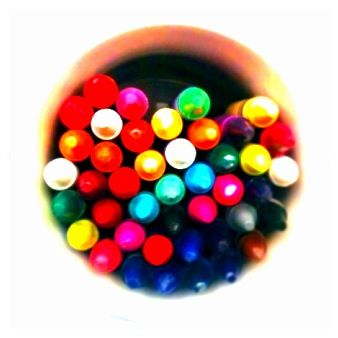 a group of colorful balls are in a bowl