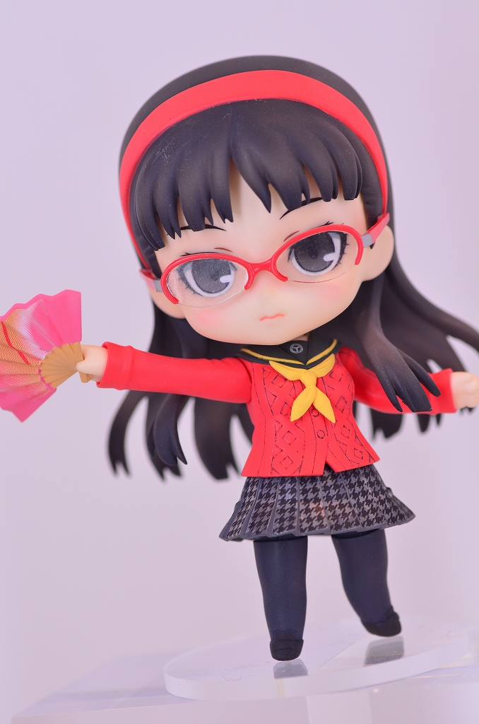 an image of a doll with red glasses
