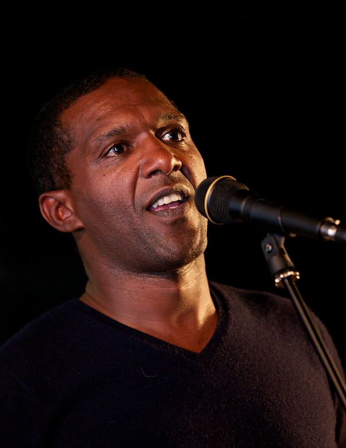 a man standing in front of a microphone