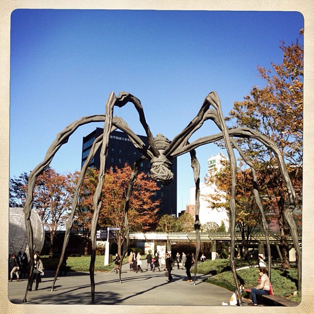 a large sculpture of a giant spider outside