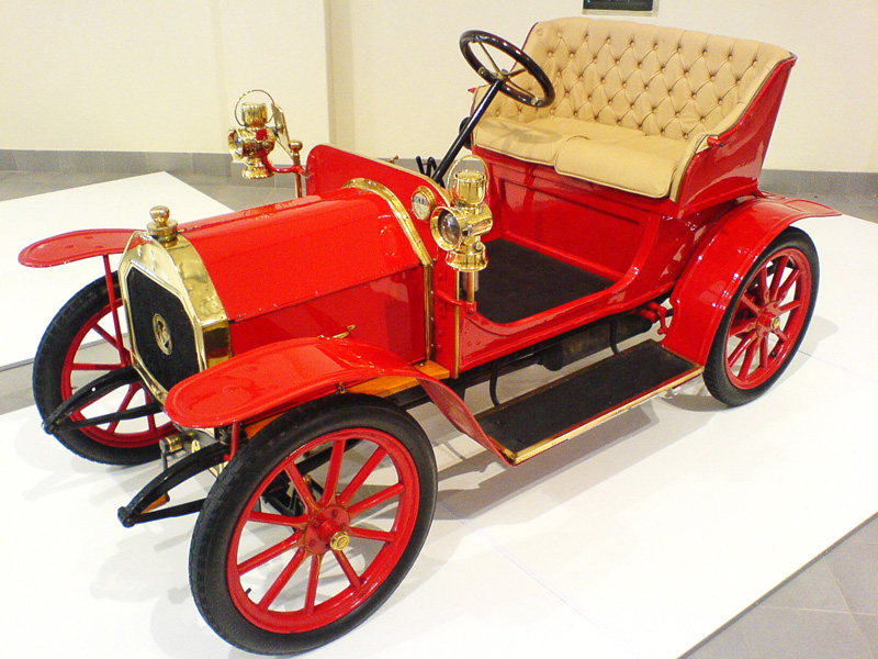 the model car is sitting on display at the museum