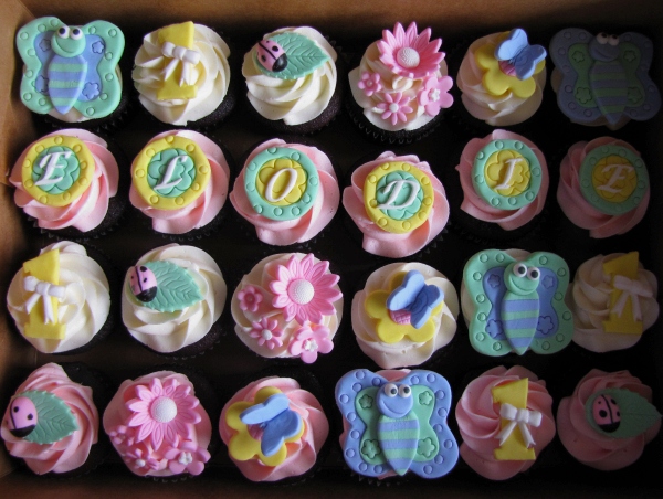 cupcakes are decorated with frosting in a box