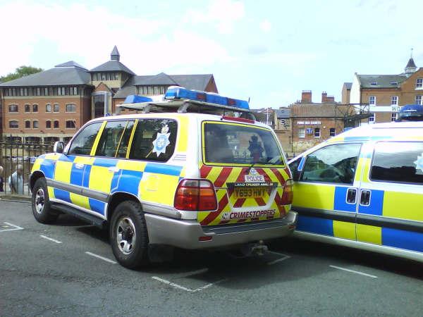 an image of an police car and other vehicles in traffic