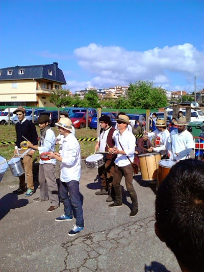 people with hats stand around and talk