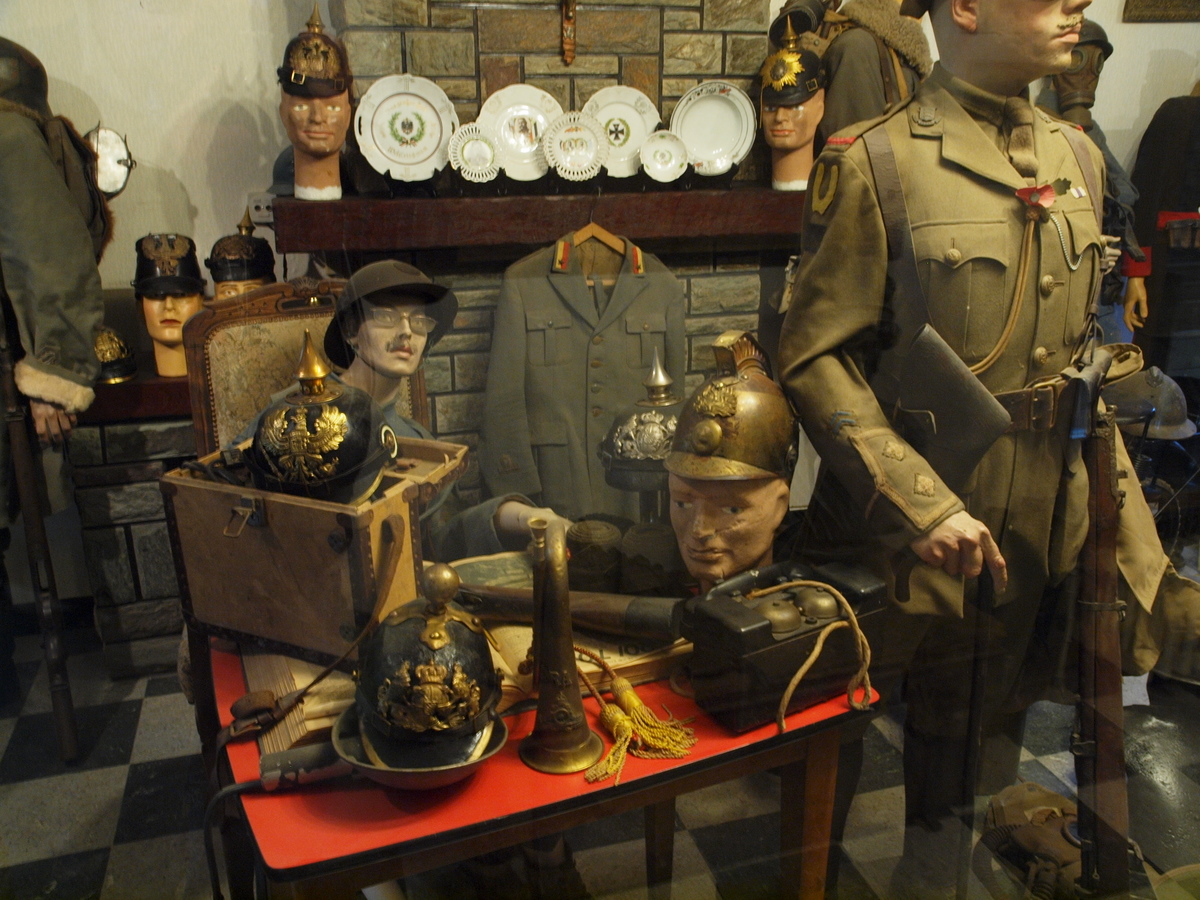 a display in a store filled with mannequins wearing military uniforms