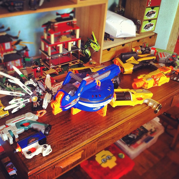 many toy vehicles are arranged on the counter