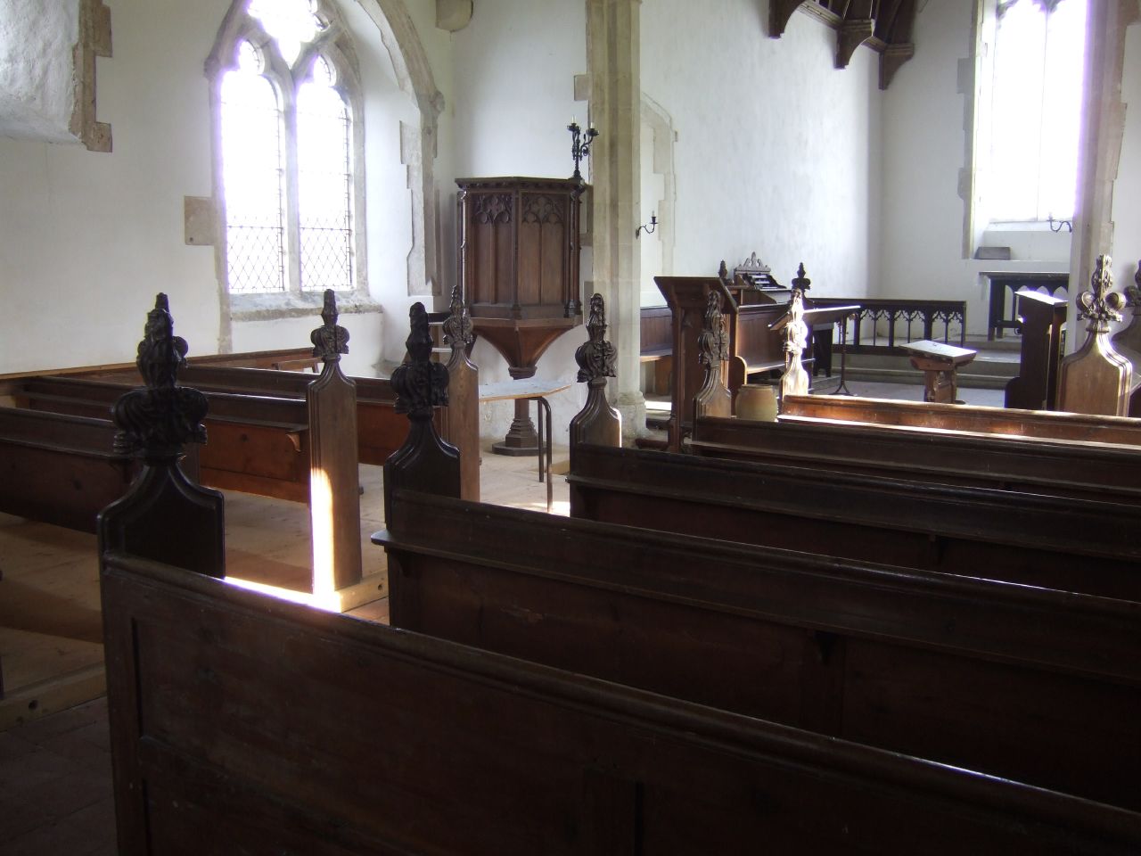 inside view of an old church with pews