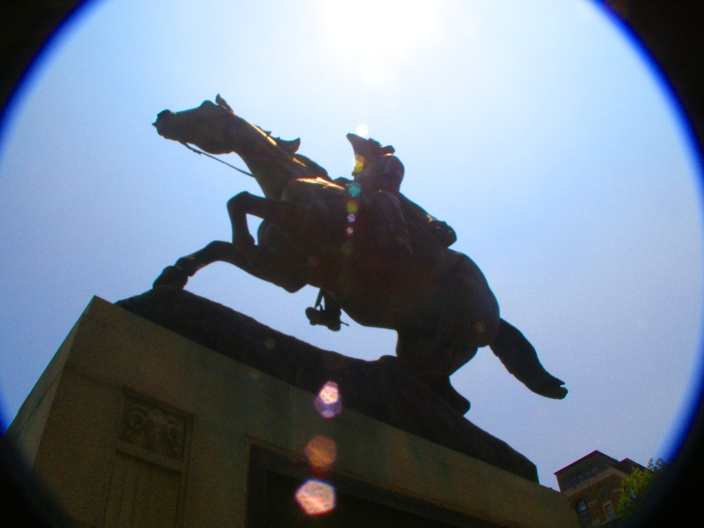 a silhouette po of a statue that looks like a horse and rider