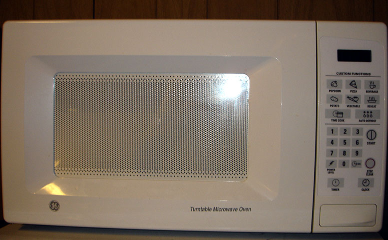 a white microwave sitting on top of a counter