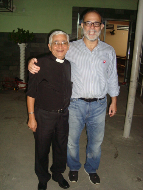 two men, one in glasses and one in a black shirt