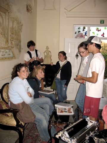 a group of people who are sitting in chairs