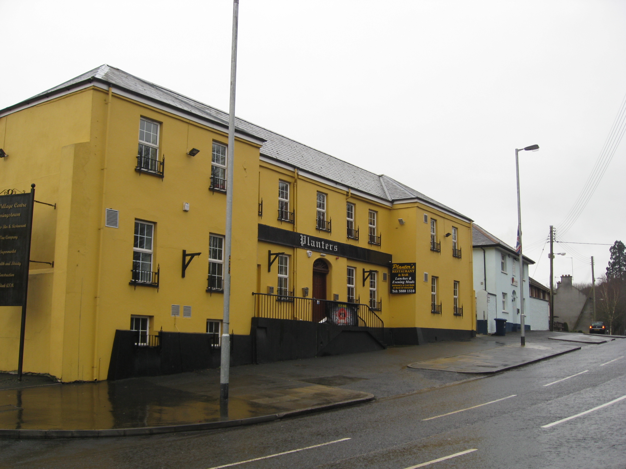 a yellow brick building with windows on each side
