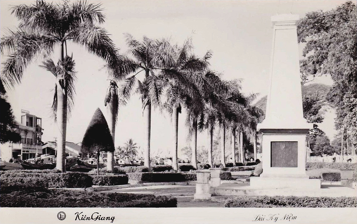 an old po of the entrance to a courtyard with trees