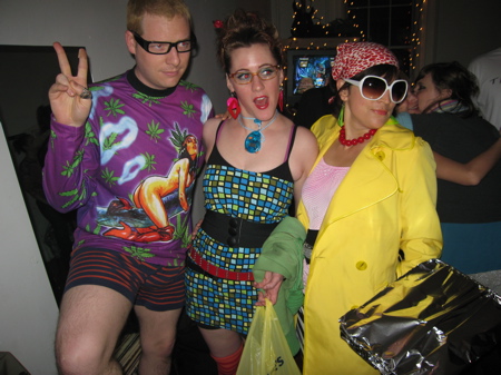 three people are dressed in costumes for a party