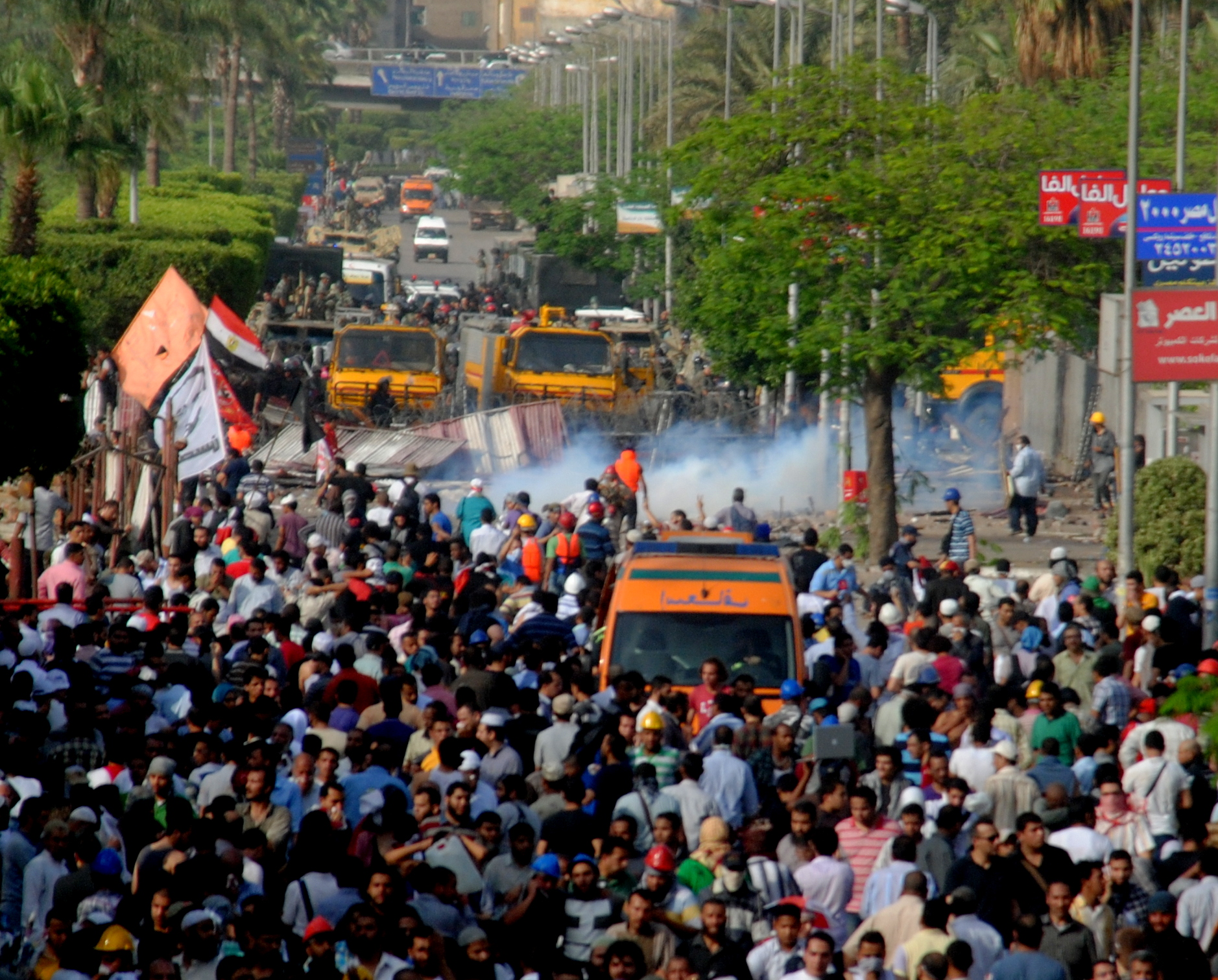 a crowd is gathered in the streets outside