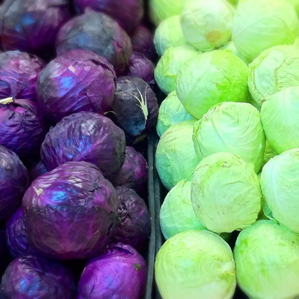 a group of green and purple vegetables next to each other