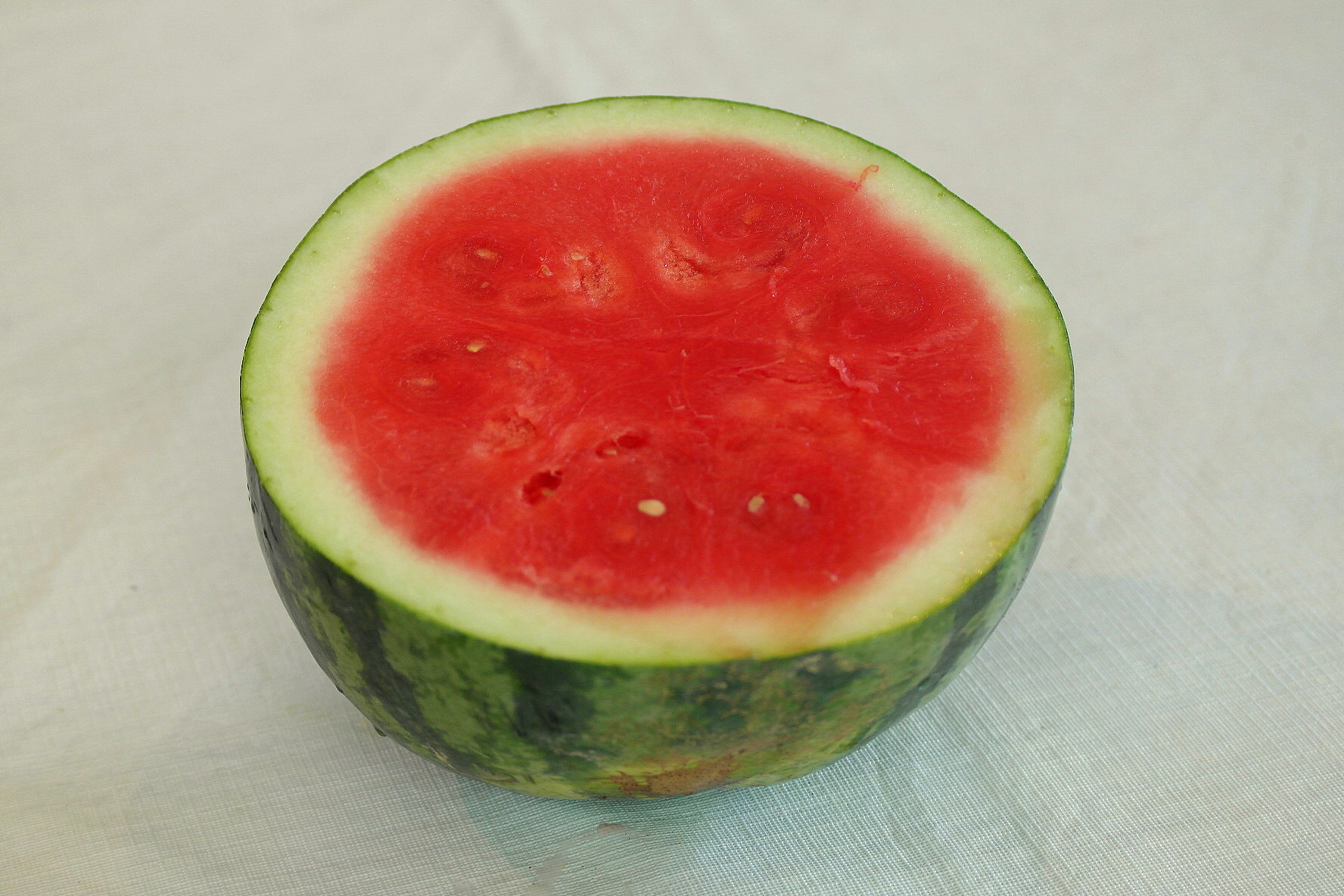 a sliced red watermelon on a white background
