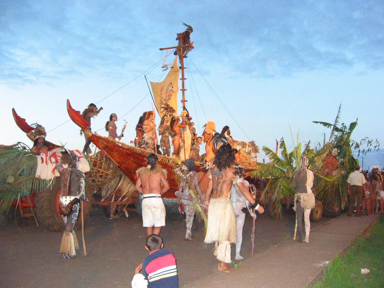 people dressed in native garb, and with no tops on