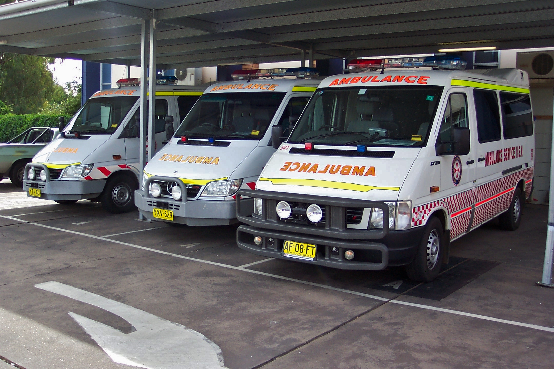 ambulances parked in a row next to each other