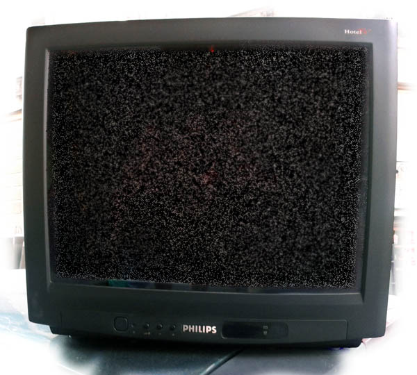 a black television sitting on top of a white counter