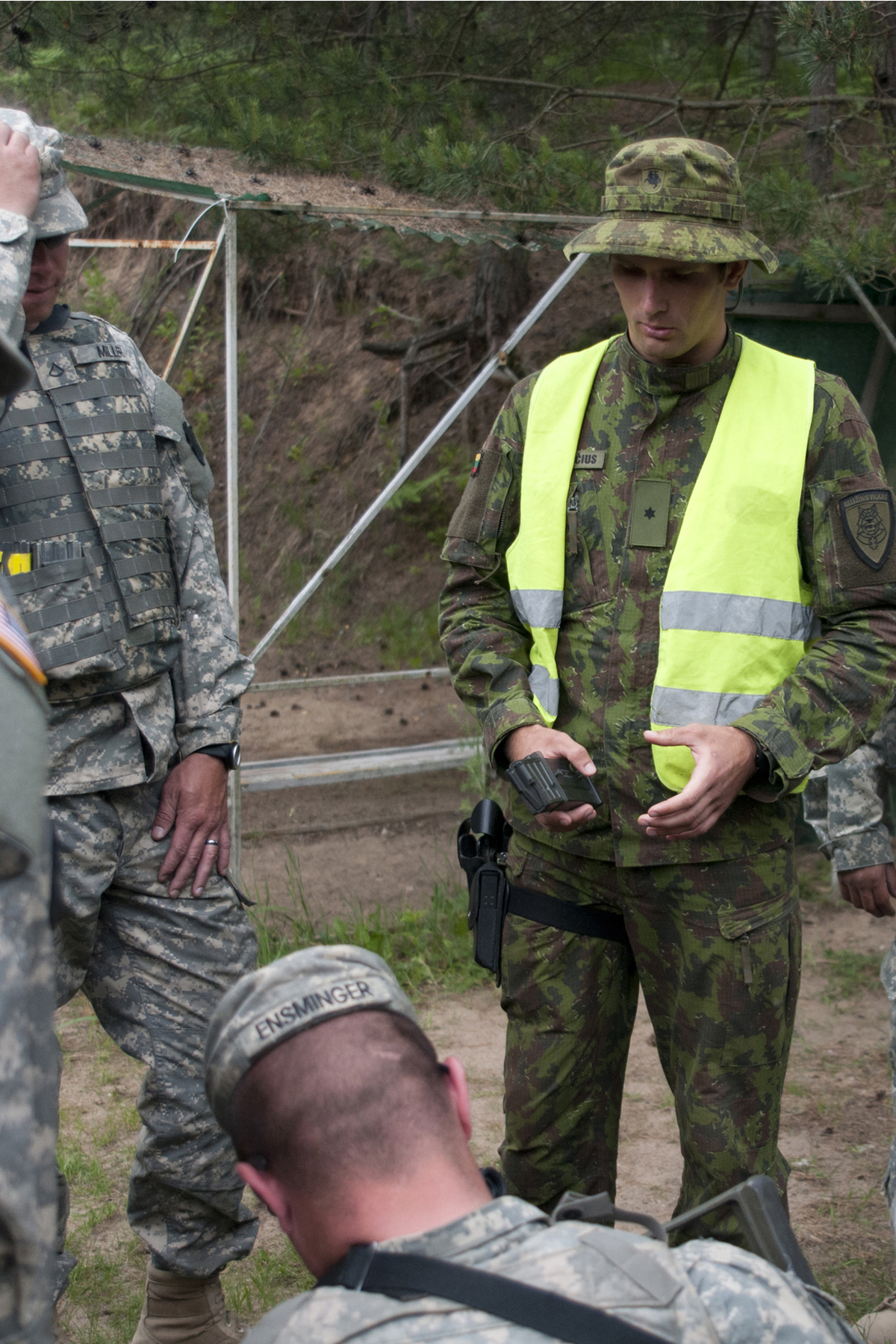 an image of military men looking at soing