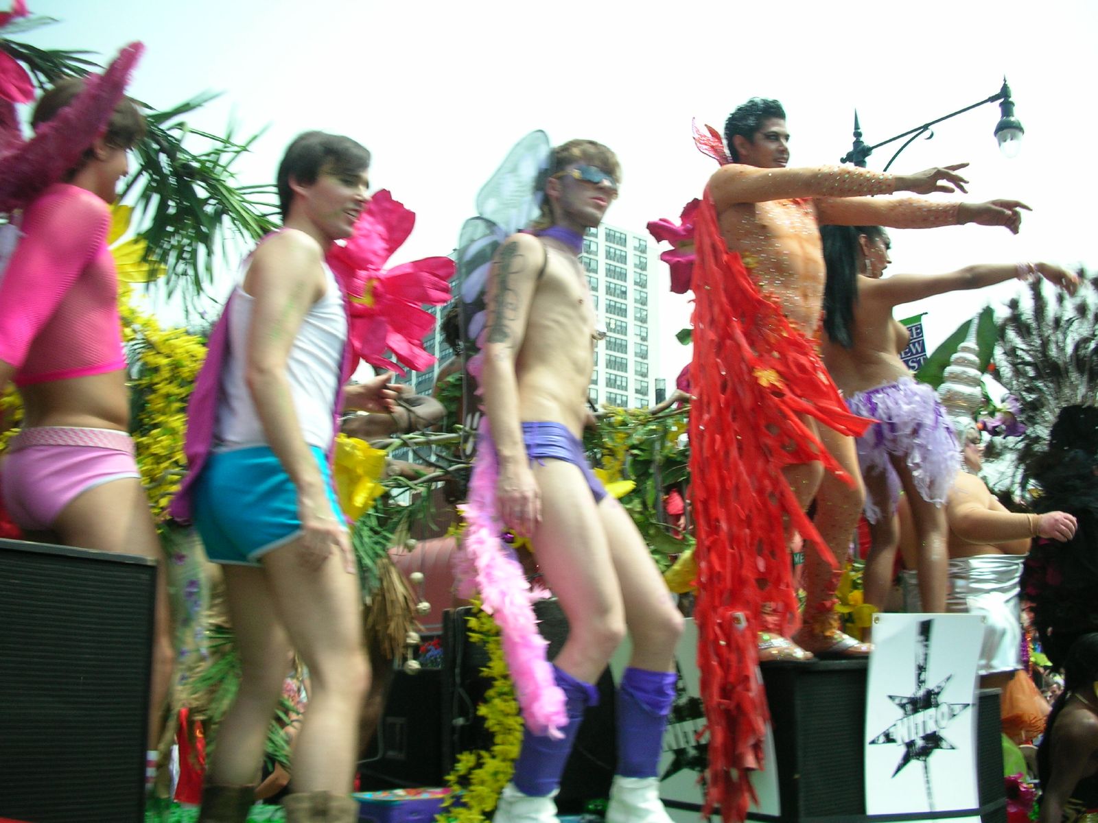 a group of men in costume performing at an outdoor parade