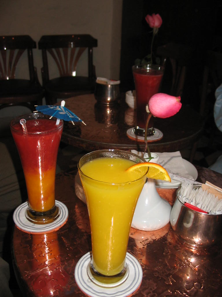 three different kinds of drinks sit on a table