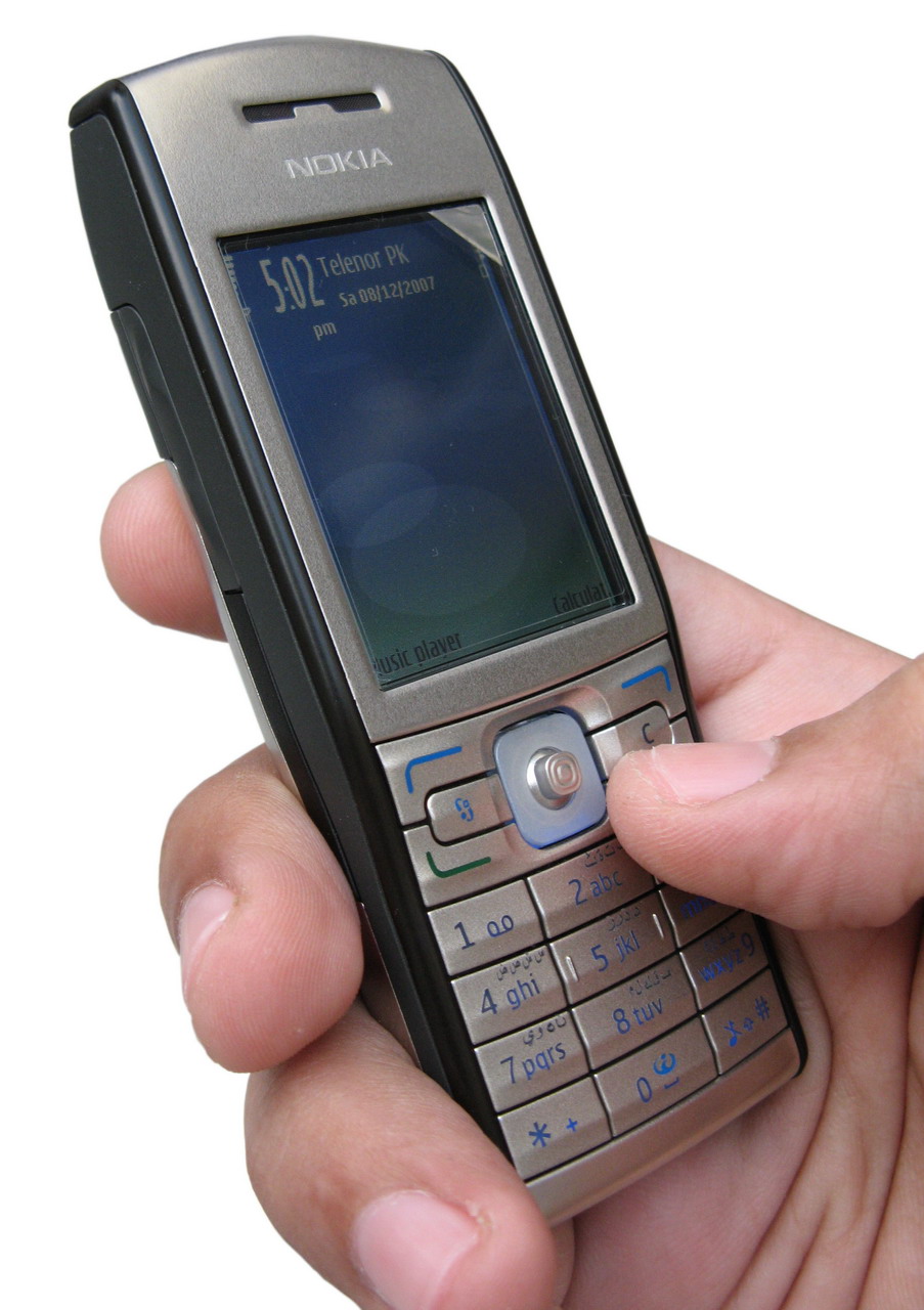 a person holding up a cell phone in their hands