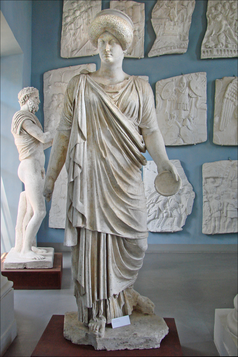 the statues have many pieces of white plaster