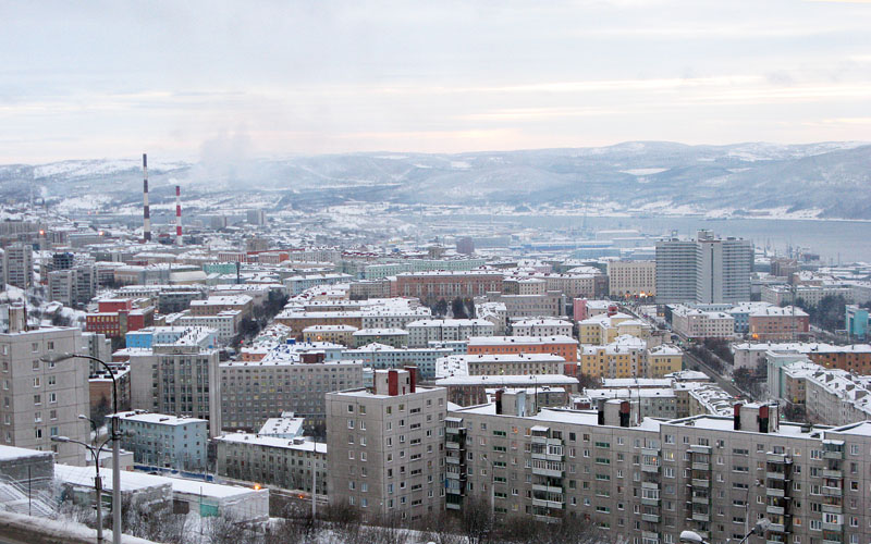 a city with a lot of buildings on a hillside