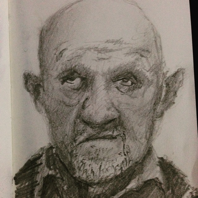 a drawing in a notebook of an old man