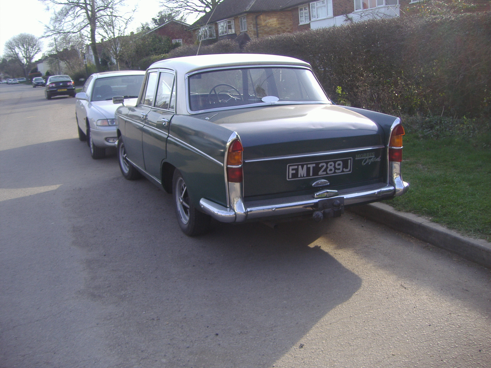 a close up of the back of a car on a street