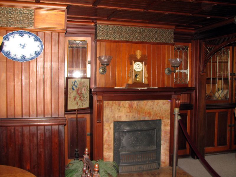 a room is decorated in an old style with wood paneling