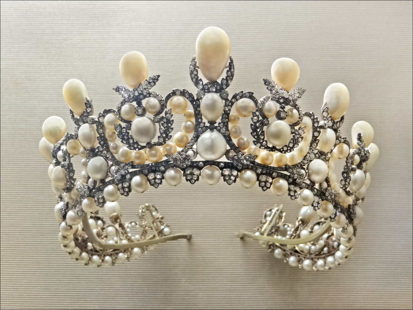 an ornate pearled tiara on display