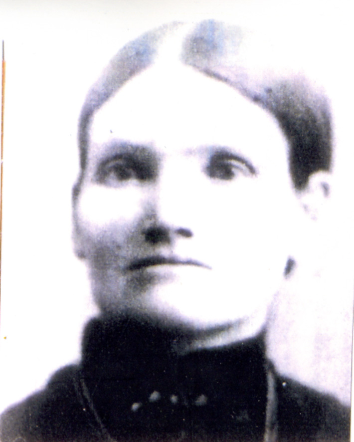 a woman wearing a black shirt and a necklace