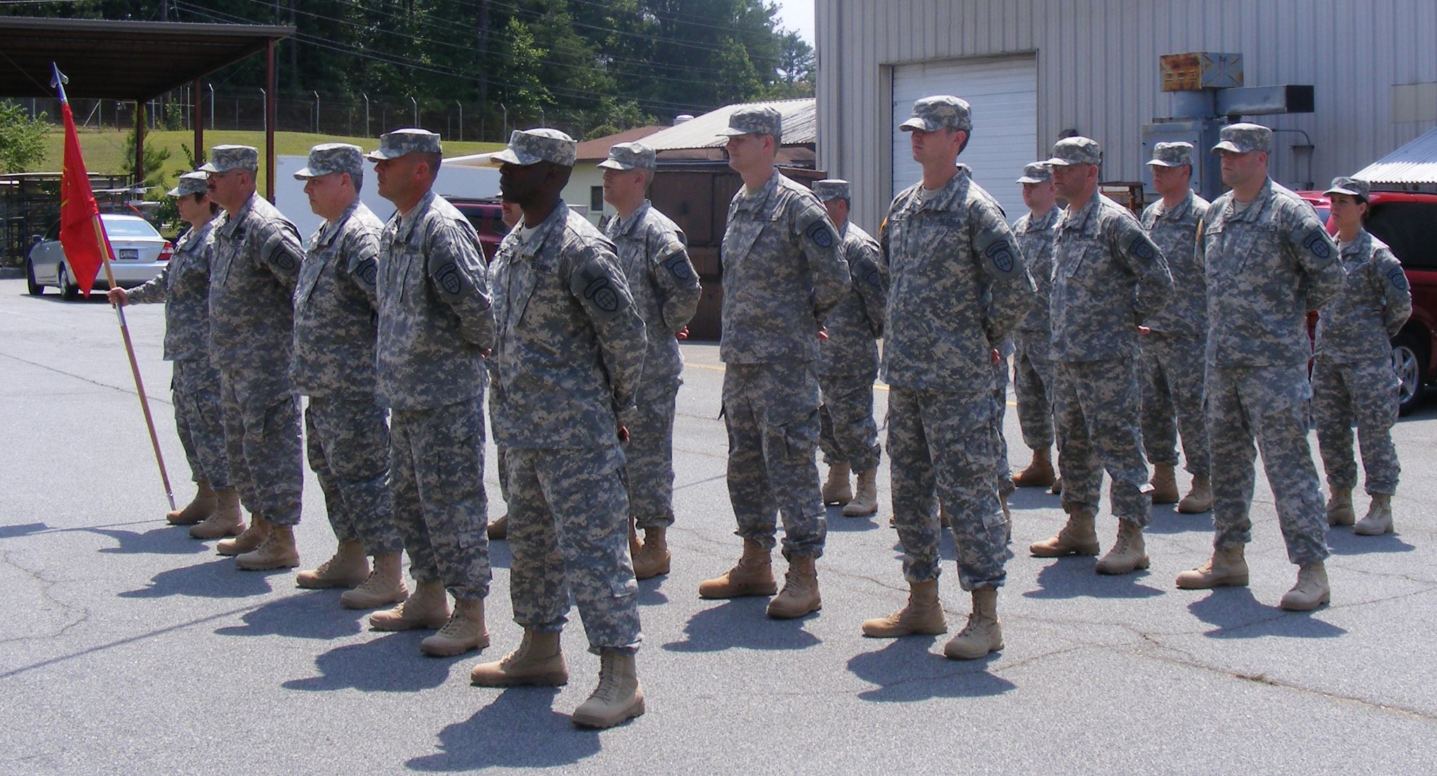 a group of military people that are standing in the street