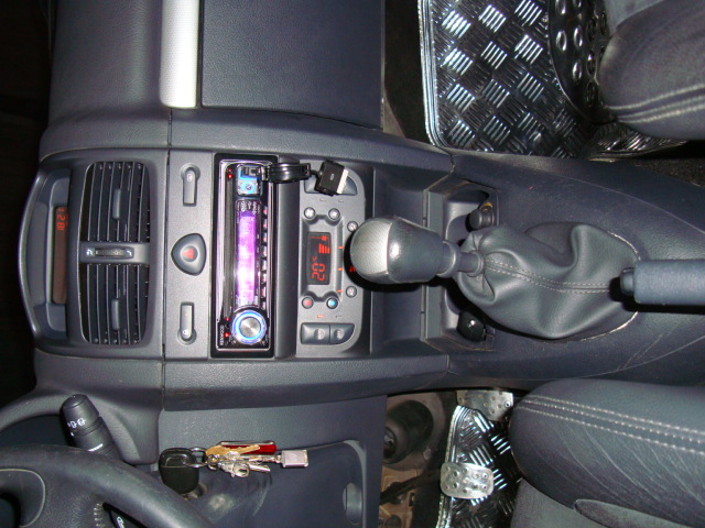 the interior of a car, with an automatic steering wheel and dash control