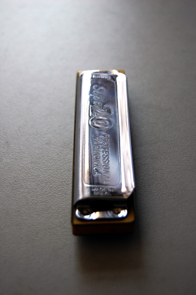 a rectangular bar on a shiny surface with gold trim